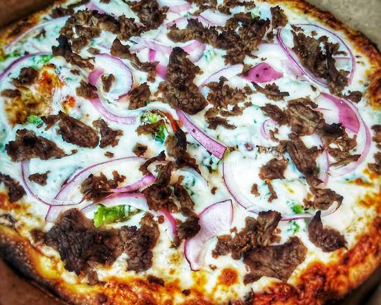 Extra grande pizza au steak